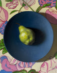 green pear on a plate painting