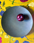 plum on a plate painting